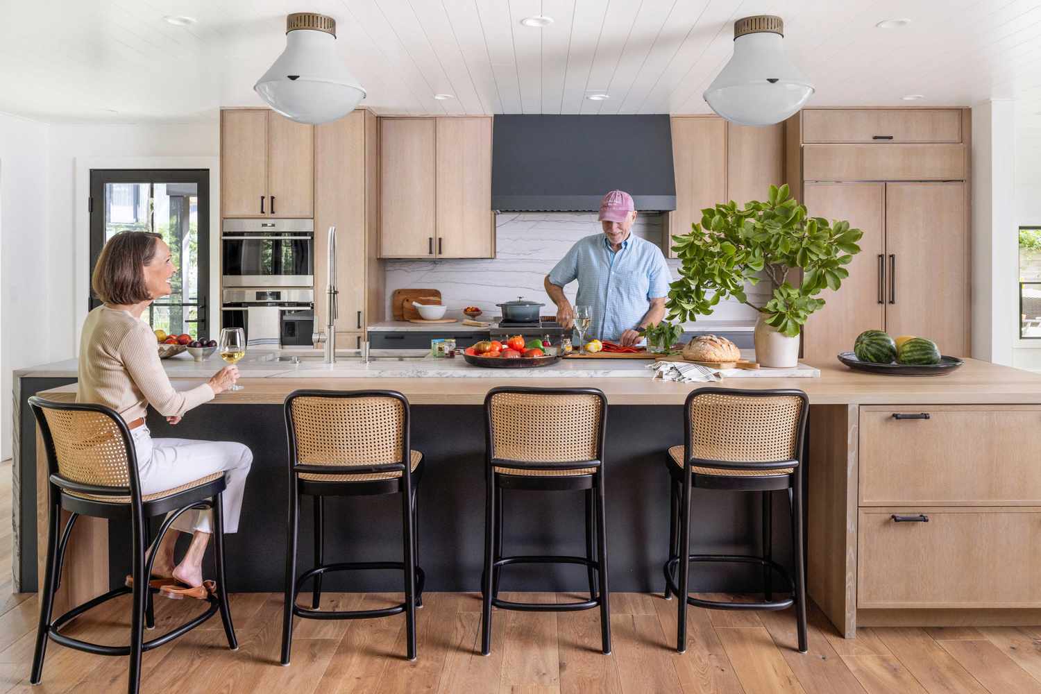 Modern kitchen remodeling project in San Pedro, CA with large island, custom wood cabinets, pendant lighting, and open-concept layout